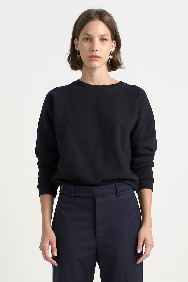 The Daily Sweatshirt in Black. On body front - Jamie Haller