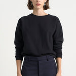 The Daily Sweatshirt in Black. On body front - Jamie Haller