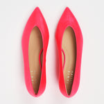 A pair of bright pink pointed-toe flats with tan insoles, photographed from a top-down view on a white background. The brand name 'JAMIE HANLEY' is printed on the insole.
