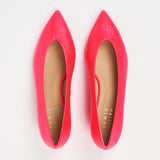 A pair of bright pink pointed-toe flats with tan insoles, photographed from a top-down view on a white background. The brand name 'JAMIE HANLEY' is printed on the insole.