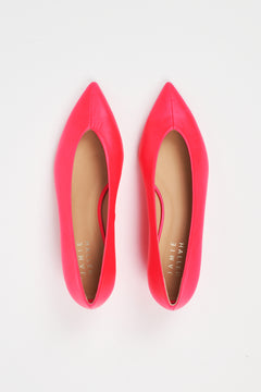 A pair of bright pink pointed-toe flats with tan insoles, photographed from a top-down view on a white background. The brand name 'JAMIE HANLEY' is printed on the insole.