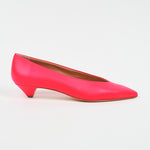 A single bright pink pointed-toe kitten heel pump shown in a side profile on a clean white background.